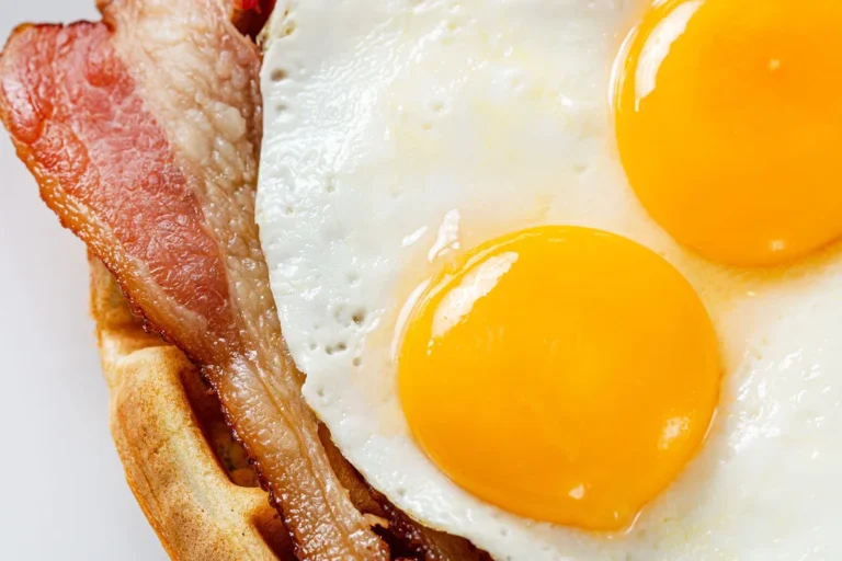 Best breakfast in Aruba with savory waffles, eggs, and bacon at Waffles Beach House
