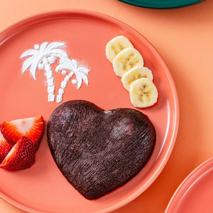 Best breakfast in Aruba with vegan and gluten free waffle shaped like a heart with fresh fruit at Waffles Beach House
